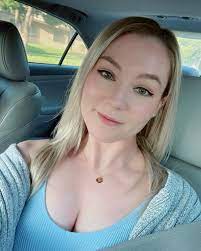 People mingling and laughing at a speed dating event.